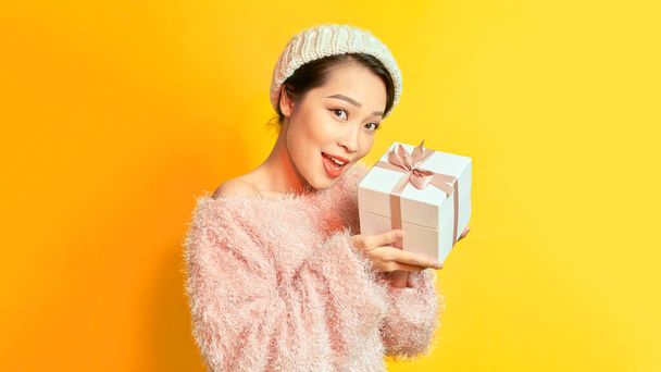 Asian girl with gift in her hands.  - Fotoğraf, Görsel