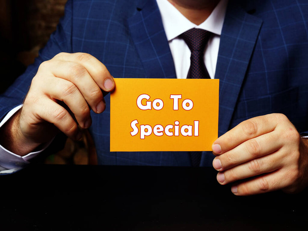 Business concept meaning Go To Special with phrase on blank business card in hand - Zdjęcie, obraz