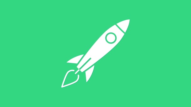 Cohete blanco con icono de fuego aislado sobre fondo verde. Viaje espacial. Animación gráfica de vídeo 4K - Imágenes, Vídeo
