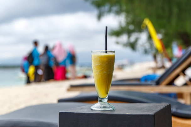 Pineapple smoothie on the beach table - Photo, Image