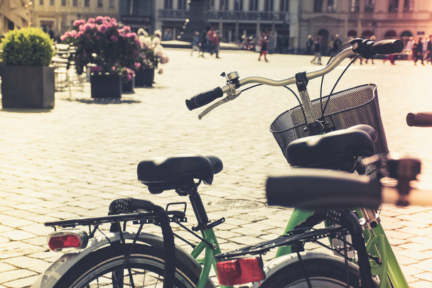 Travel concept photo of rental bikes at Neustadt Square in Dresden. Closeup sharp details of bike and atmospheric bokeh of classic 18th century architecture.  - 写真・画像