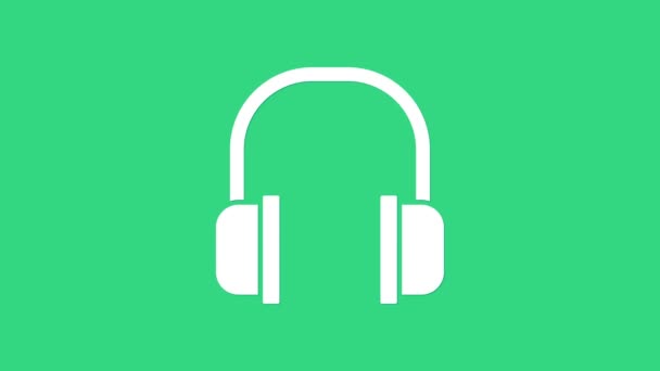 Bílá sluchátka ikona izolované na zeleném pozadí. Nápis na sluchátka. Koncepce poslechu hudby, služeb, komunikace a operátora. Grafická animace pohybu videa 4K - Záběry, video