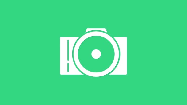 緑の背景に隔離されたホワイトフォトカメラアイコン。カメラのアイコン。4Kビデオモーショングラフィックアニメーション - 映像、動画