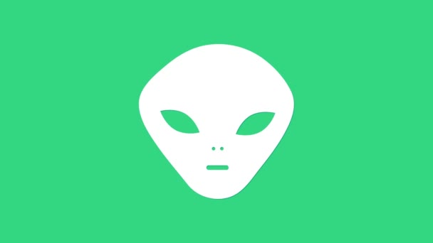 Icône Alien blanche isolée sur fond vert. Visage extraterrestre extraterrestre ou symbole de tête. Animation graphique de mouvement vidéo 4K - Séquence, vidéo
