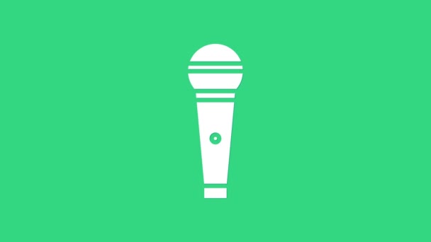 Icona microfono bianco isolato su sfondo verde. Sul microfono radio in onda. Segnale di altoparlante. Animazione grafica 4K Video motion - Filmati, video