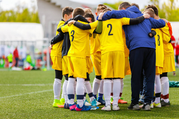 Teenage Boys in Sports Team. Boys Huddling in a Circle with Coach Before the Final Game. Coach GIving Motivational Speech to Youth Sports Team - Photo, Image