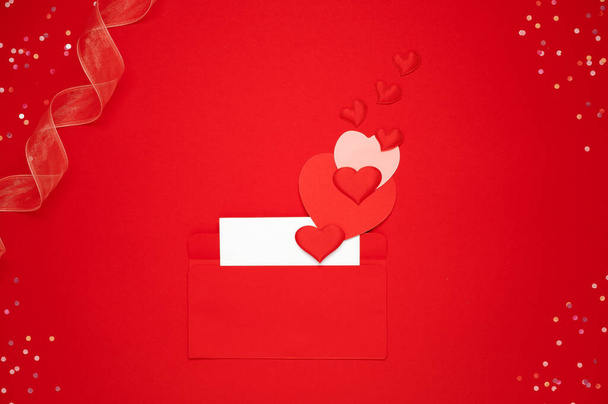 Love letter, valentine postcard with many colored hearts and confetti on red background - Photo, Image