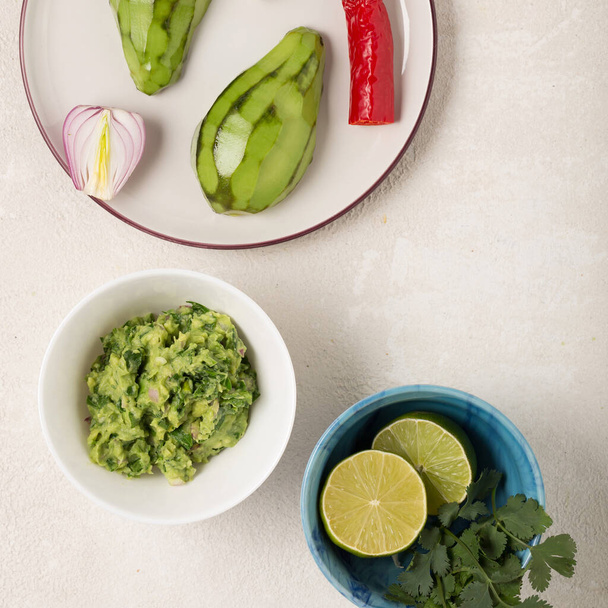 recipe for Mexican appetizer Guacamole with avocado and cilantro - Photo, Image