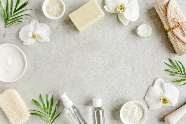 Spa treatment concept. Natural,Organic spa cosmetics products, sea salt, massage brush. Spa background with a space for a text, flat lay, top  - Valokuva, kuva