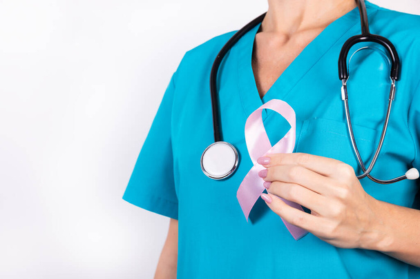 World Breast Cancer Day concept, healthcare - Pink breast cancer awareness ribbon, symbolic colored ribbon to raise awareness for people living with a female breast tumor - Foto, afbeelding