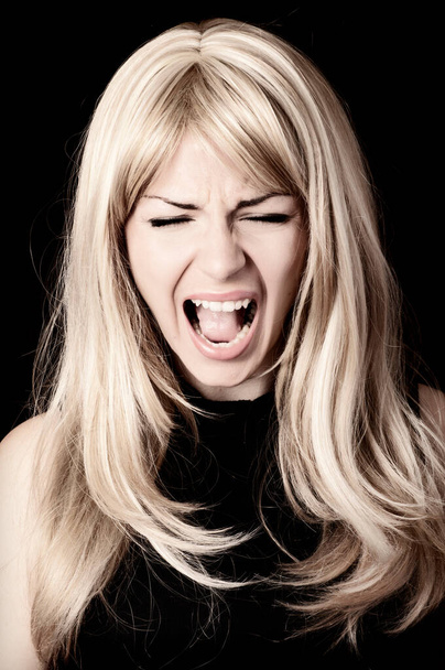 Blonde young woman screaming - Photo, Image