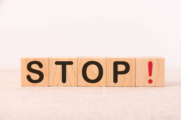 STOP word concept written on a light table and light background - Foto, Imagen