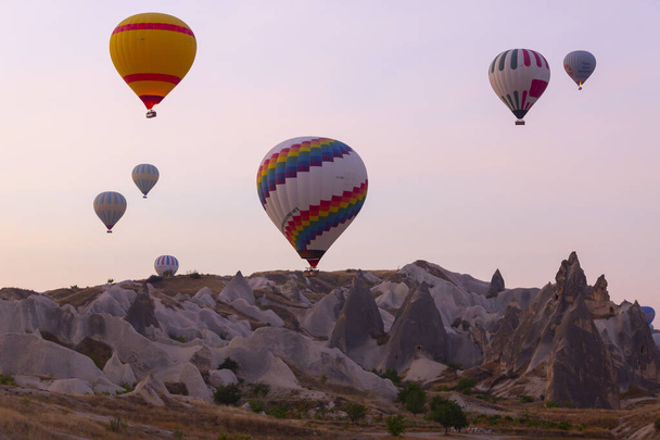 One of the most popular activities in Cappadocia is Cappadocia with hot air balloons. - Zdjęcie, obraz