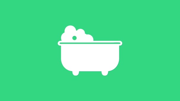 Witte babybadkuip met schuimbellen binnenin pictogram geïsoleerd op groene achtergrond. 4K Video motion grafische animatie - Video