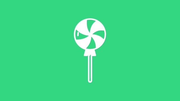 緑の背景に隔離された白いロリポップアイコン。キャンディサイン。食べ物、おいしいシンボル。4Kビデオモーショングラフィックアニメーション - 映像、動画