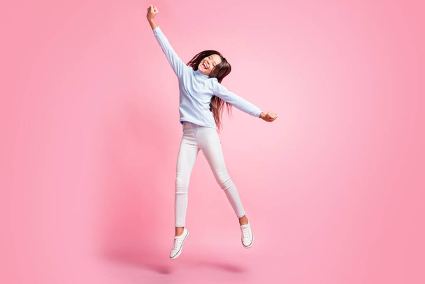 Full length body size view of pretty glad cheerful girl jumping dancing having fun isolated over pink pastel color background - Fotoğraf, Görsel