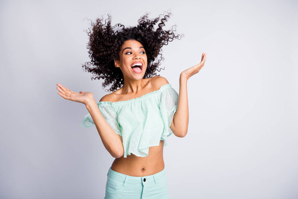 Photo portrait of excited laughing girl with flying hair isolated on white colored background - Foto, Imagem