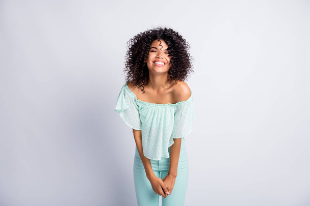 Photo portrait of overjoyed black skinned girl laughing wearing fashionable mint clothes isolated on grey color background - Фото, изображение