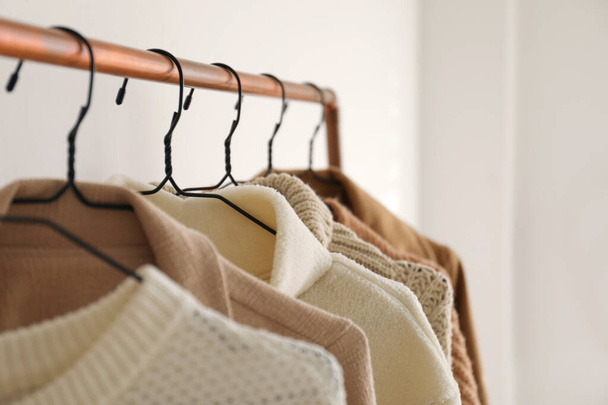 Rack with stylish women's clothes indoors, closeup. Modern interior design - Foto, Imagem