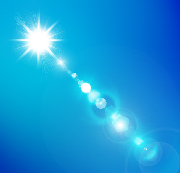 Яркое солнце в голубом небе с эффектом блика объектива
 - Фото, изображение