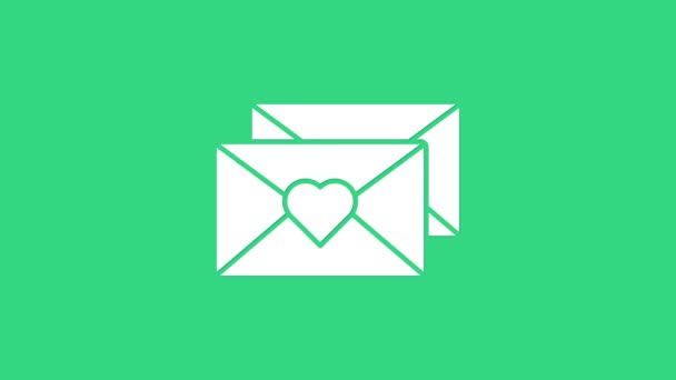 Белый конверт с иконкой сердца Валентина изолированы на зеленом фоне. Послание любви. Письмо любовь и романтика. Видеографическая анимация 4K - Кадры, видео