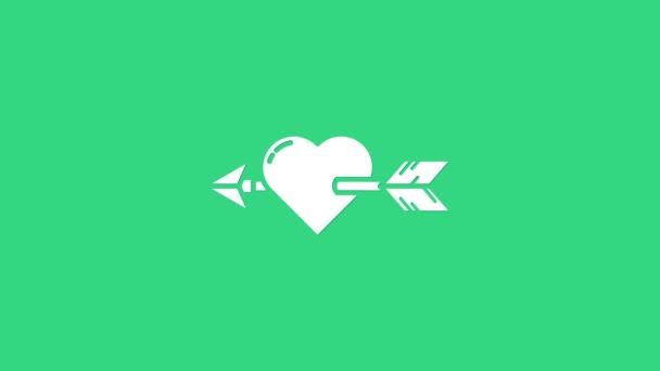 White Amour symbol se srdcem a šipkou ikona izolované na zeleném pozadí. Znamení lásky. Symbol Valentýna. Grafická animace pohybu videa 4K - Záběry, video