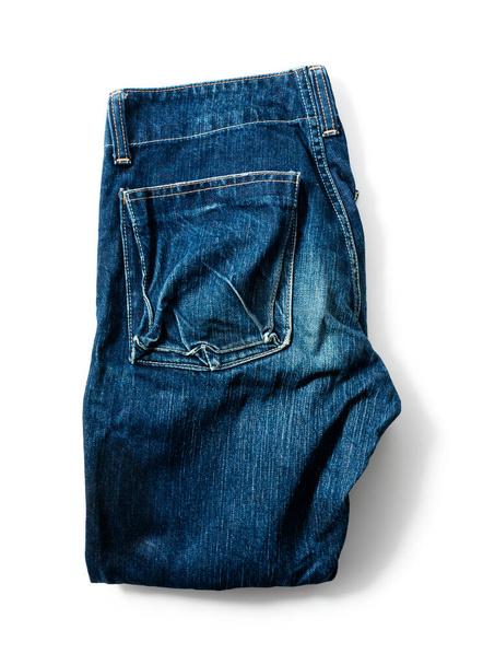 Синие джинсы на белом фоне. Вид сверху - Фото, изображение