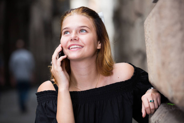 Portrait of girl teenager talking on phone - Photo, Image