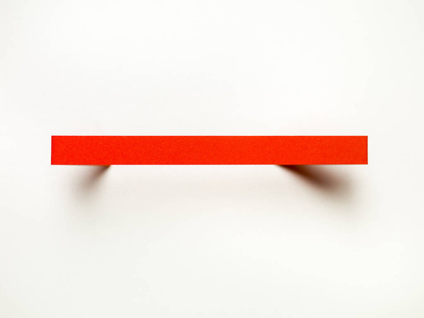 Red line made of paper on a withe background - Photo, Image