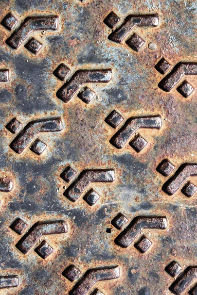 evocative image of texture of metal plate with embossed square patterns - Fotó, kép