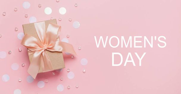 Gifts on pink background, love and valentine concept with text Womens Day - Фото, изображение