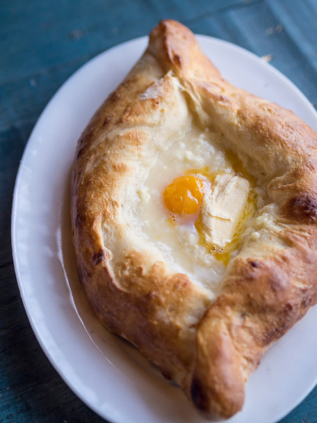 Ajaruli khachapuri - Georgian bread with egg and cottage cheese - 写真・画像