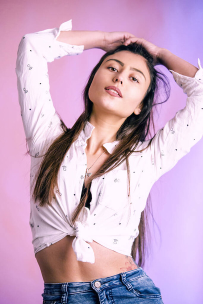 pastel portrait of sexy woman in the studio. Pink background - Photo, Image