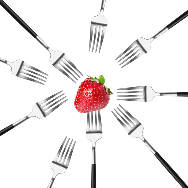 Many forks and ripe strawberry on white background - Photo, Image