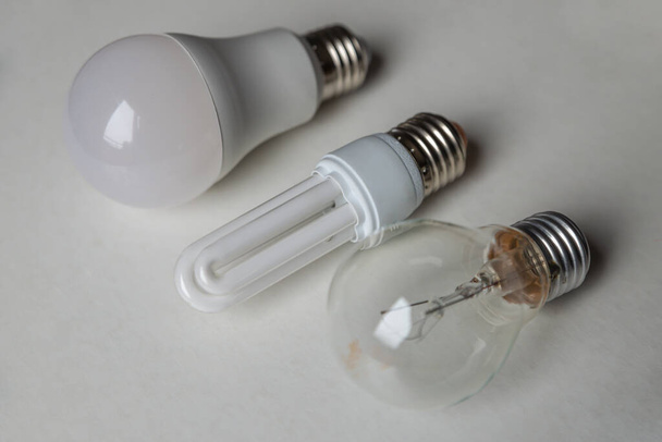 Incandescent bulb, fluorescent bulb, led bulb, next to each other. Technological evolution of light bulbs. - Photo, Image