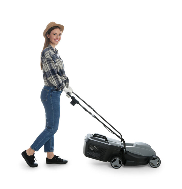 Young woman with modern lawn mower on white background - Foto, immagini