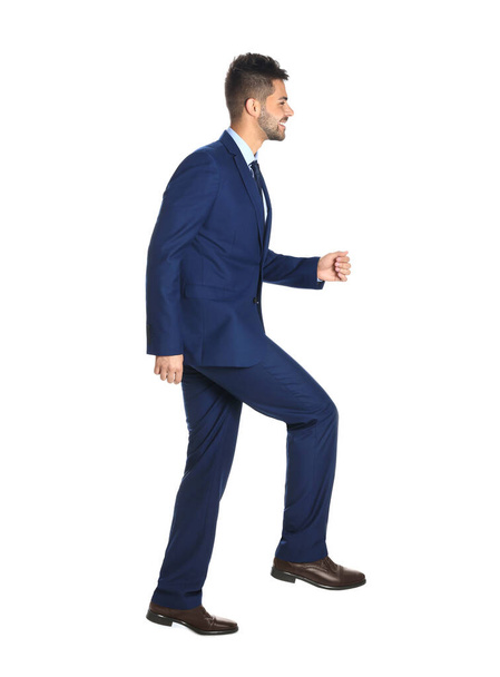 Businessman walking on white background. Career ladder - Foto, imagen