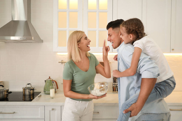 Happy family cooking together in modern kitchen - Fotografie, Obrázek