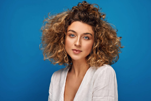 Portrait of young woman with blonde curly hair  - Foto, Imagen