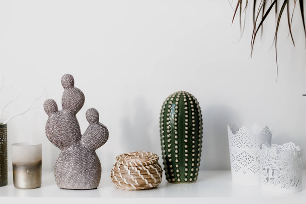Decorative artificial ceramic cactus, succulent and cactuses on white wall background - Fotoğraf, Görsel