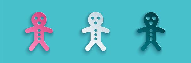 Paper cut Holiday gingerbread man cookie icon isolated on blue background. Cookie in shape of man with icing. Paper art style. Vector. - Vektor, Bild