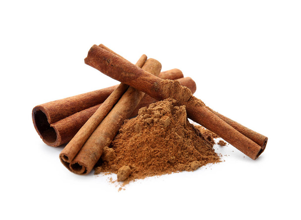 Cinnamon sticks and powder on white background - Photo, Image