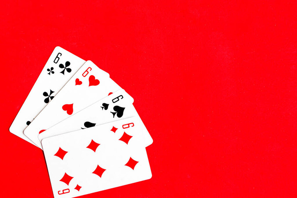 Poker quads playing card, red background - Φωτογραφία, εικόνα