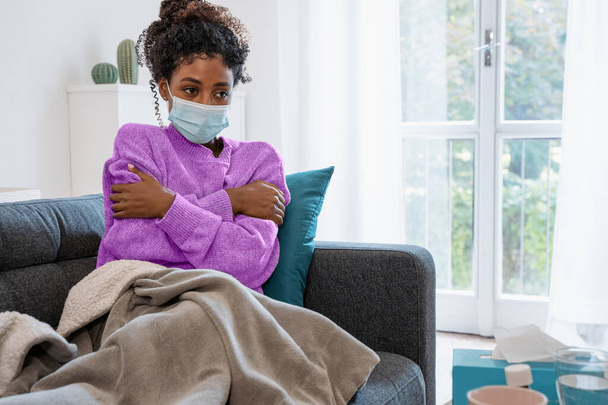 Black girl having flu, feeling bad and isolated at home - Fotografie, Obrázek