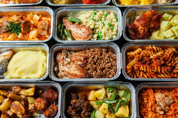 Business lunch in eco plastic container ready for delivery.Top view. Office Lunch boxes with food ready to go. Food takes away. Catering, brakfast. - Photo, Image