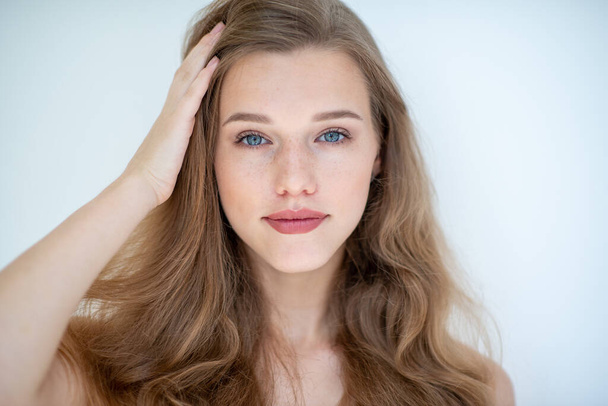 Portrait of a beautiful young woman with clean skin, beauty treatment, cosmetology and anti-aging theme - Zdjęcie, obraz