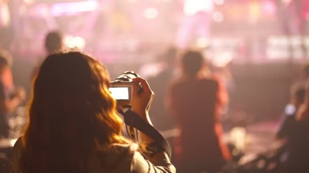 Music fan recording live performance concert with photo camera indoor. - Footage, Video