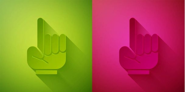 ペーパーカットグリーンとピンクの背景にアイコンを上げ指でナンバーワンのファンハンドグローブ。競技会におけるチームサポートのシンボル。紙のアートスタイル。ベクターイラスト. - ベクター画像