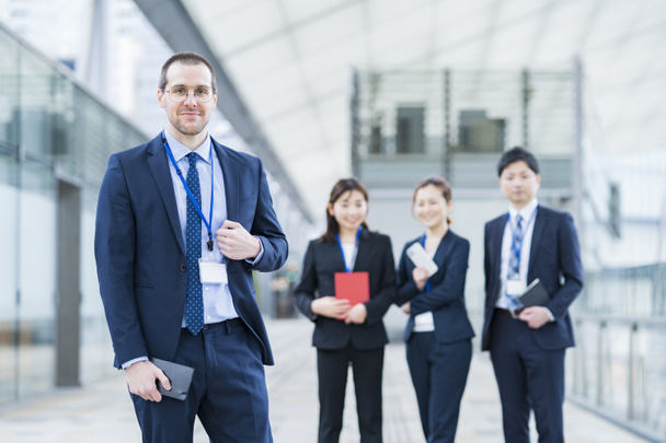 Businessman and his business team standing at office area - Photo, Image