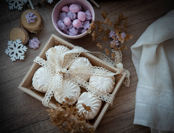 Food styling for saint Valentine's Day with wooden heart, zephyr, meringue, flowers and wooden decor - Photo, Image